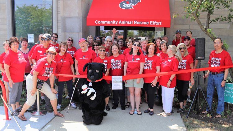 Volunteers in front of building for grand opening